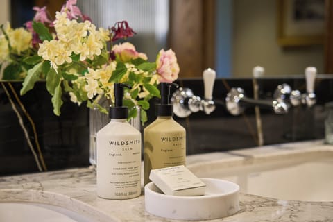 Designer toiletries, hair dryer, bathrobes, slippers