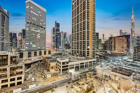 City View: Experience breathtaking skyline vistas from your private balcony at sunset!