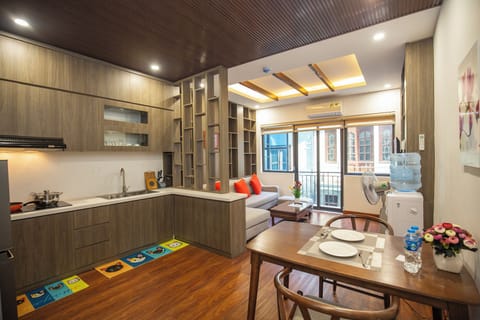 Deluxe Apartment, City View | Living area | 50-inch flat-screen TV with cable channels