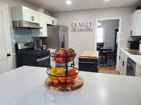 Full kitchen with island. All new appliances, basic spices and condiments