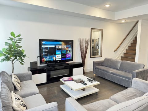 living room has 3 full size sofa beds 