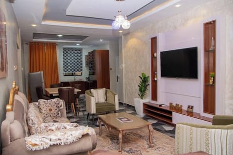 Deluxe Apartment, Balcony, City View | Living area | Flat-screen TV