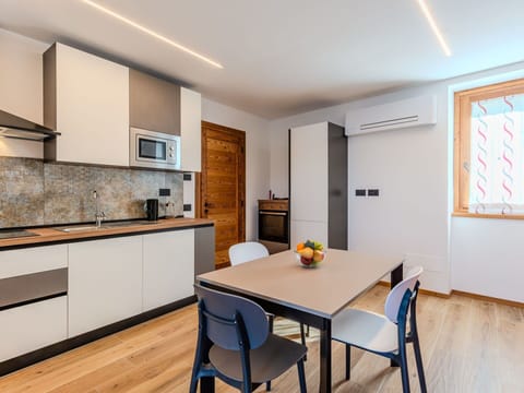 Furniture, Interior Design, Flooring, Wood, Ceiling, Kitchen, Floor, Room, Lighting, Countertop