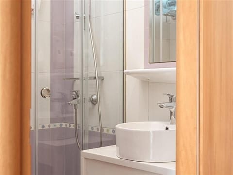 Shower, rainfall showerhead, hair dryer, towels