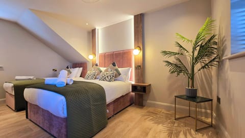 Deluxe Triple Room | Memory foam beds, iron/ironing board, travel crib, free WiFi