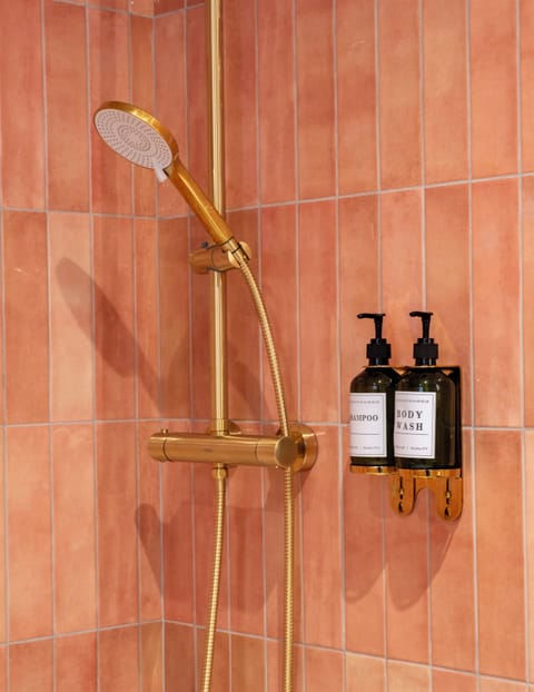 Shower, hair dryer, heated floors, towels