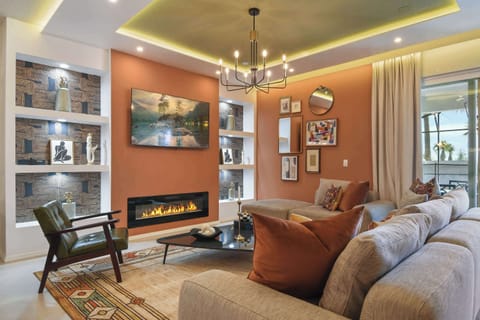 Cozy modern living room with fireplace, chic decor, and charm!