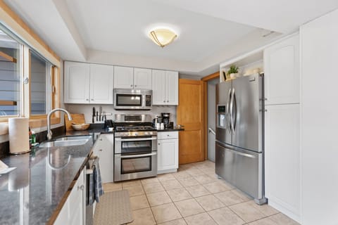 Your fully equipped kitchen awaits with sleek granite countertops, stainless steel appliances, and everything you need to create memorable meals together.
