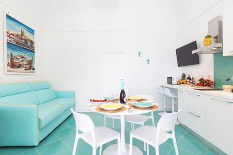 Apartment, Sea View | Living area | 32-inch flat-screen TV with digital channels