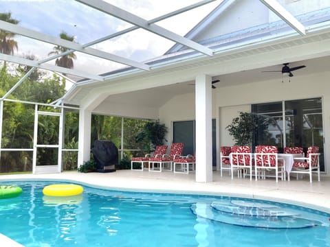 bean shape swimming pool and screened lanai