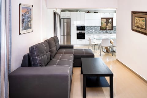 Deluxe Apartment, Sea View | Living area | TV