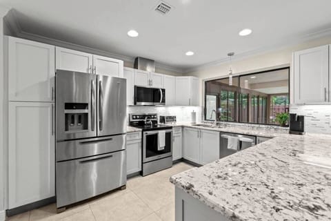 The renovated kitchen is a chef's delight, with all the space and essentials needed to craft memorable meals together.