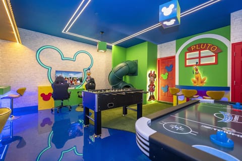 Vibrant game room with foosball and air hockey tables