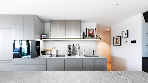 A sleek kitchen with everything you need for your stay