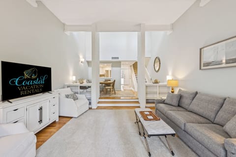 Living room with flat screen tv with queen sleeper sofa.