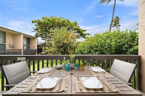 Furnished garden‑view lanai with outdoor dining, ideal for relaxed island meals.