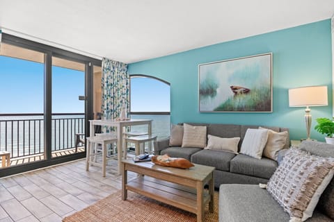 This oceanfront condo offers a rare glimpse of the sunrise and sunset in North Myrtle Beach. The end unit is a spectacular place to enjoy panoramic views of the coastline. Enjoy the sofa sleeper and Smart TV or step out onto the oceanfront balcony.