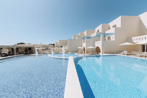 Outdoor pool, open noon to 7:00 PM, pool umbrellas, sun loungers