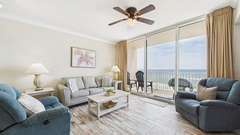 Open concept living area with stylish furnishings TV and sleeper sofa