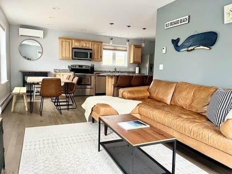 Open concept living room with smart TV, games, and books for guest use!