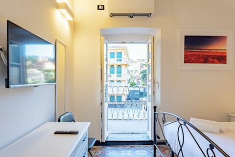 Apartment, 2 Bedrooms, Balcony, City View | 2 bedrooms, desk, laptop workspace, iron/ironing board