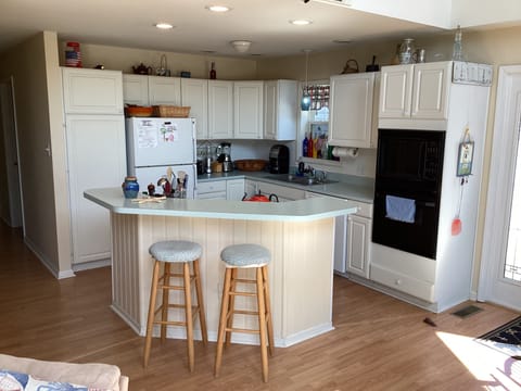 Well equipped kitchen with island seats