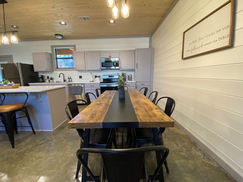 Gather ‘round as this cozy kitchen and rustic dining space