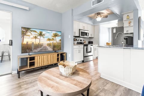 Enjoy seamless flow between the living room and kitchen area, perfect for open-concept living and easy entertaining