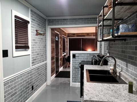 galley kitchen with bar looking into family rm, total dining seating for 6