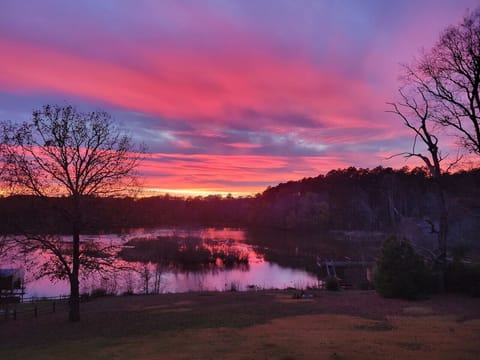 Our spacious backyard is packed with fun—kayaking, cornhole, and scenic sunset views.