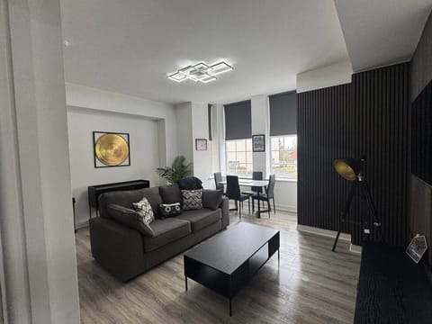 living area with sofa, dining area and smart tv