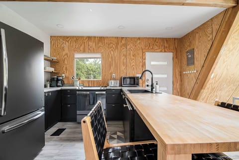 Full kitchen with everything you need to cook at home - including your morning coffee with local coffee grounds.