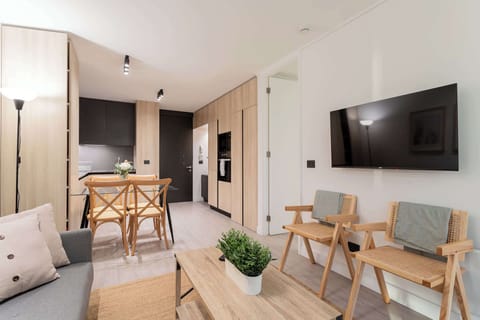 Experience modern comfort in this stylish living space, featuring sleek furniture and a cozy atmosphere perfect for relaxation.