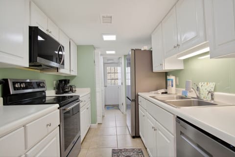 Kitchen off dining room with access to laundry room