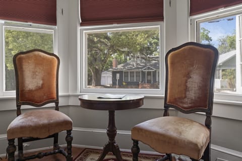 soak in the sun in the king bedroom with beautiful front yard views