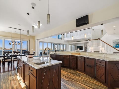 Enjoy breathtaking views from this beautifully designed interior as natural light floods the space, creating an inviting and luxurious atmosphere throughout.