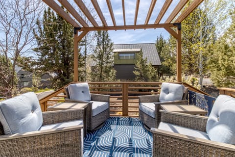 Sit back and sway. 🌿🪑
A cozy outdoor seating area with four rocker glider chairs, perfect for relaxing and enjoying the view.