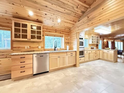 Full kitchen with appliances, cookware, dishes, silverware, and basic cooking spices.