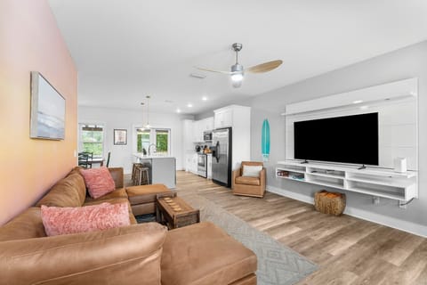 Spacious living room with a sectional and smart TV