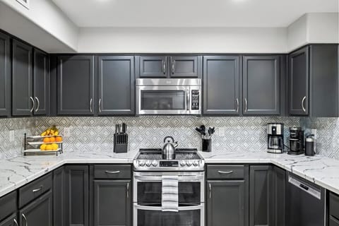 Generous counter space and an eat-up bar make this kitchen both functional and stylish.