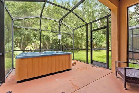 Find tranquility in the cozy screened patio, enjoying the view from the jacuzzi.