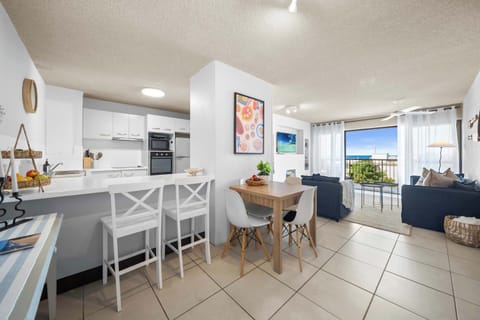 The open plan kitchen, dining & living is vibrant and inviting.