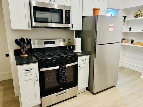 Elevate your culinary experience at Jungle House Airbnb with our sleek and modern kitchen, complete with stainless steel appliances and elegant finishes  Your gourmet retreat in Short North Columbus