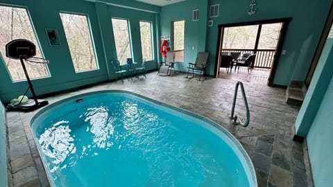 Secured lower level heated indoor pool with deck for you to enjoy.