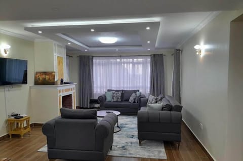 Family Villa, Balcony, Garden View | Living area | 32-inch Smart TV with digital channels