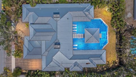 Arial view of this stunning resort-style mansion with heated pool just moments from Lido Key Beach. and St Armands Circle