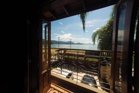 Deluxe Double Room, Lanai, Beach View | Minibar, desk, laptop workspace, iron/ironing board