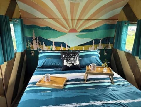 Queen bed with extra blankets and foam mattress