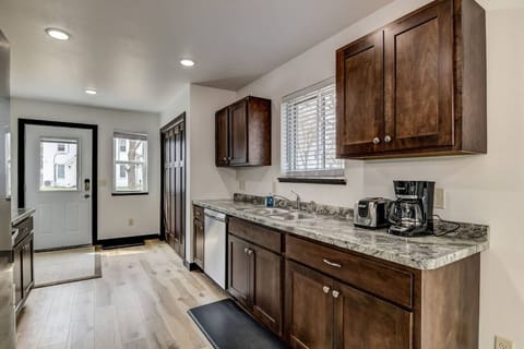 Kitchen with dishwasher and brand new appliances.