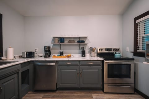 The large kitchen is located next to the living room so that no-one has to miss out on the fun!